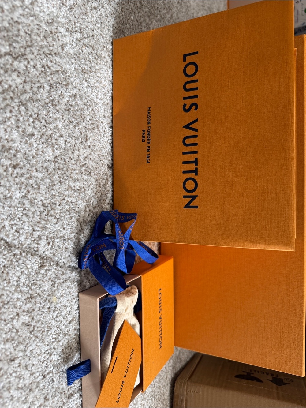 Louis Vuitton Orange Boxes with Blue Branded Ribbon